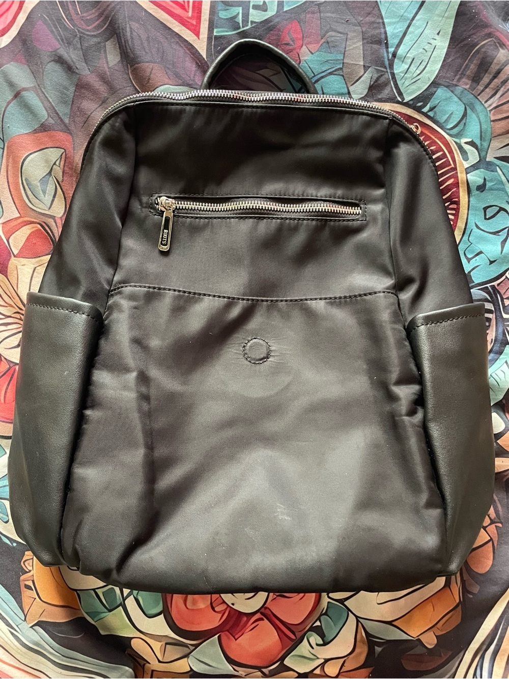 Roots Black Backpack with Silver Zipper
